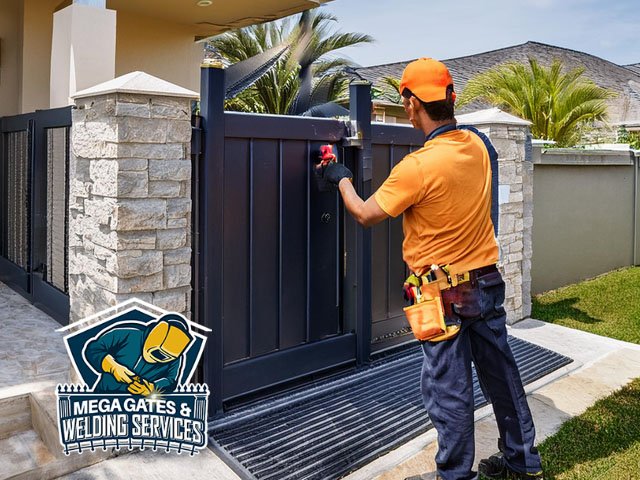 professional technician working performing expert installation of automatic gates at residential home